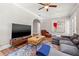 Living room with hardwood floors, large TV and comfortable seating at 1511 Prescott S St, St Petersburg, FL 33712