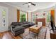 Living room with hardwood floors, fireplace and sectional sofa at 1511 Prescott S St, St Petersburg, FL 33712