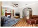 Spacious living area with hardwood floors, a fireplace, and comfortable seating at 1511 Prescott S St, St Petersburg, FL 33712
