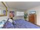 Spacious bedroom with a dresser and large bed at 1605 Mission Hills Blvd # D5, Clearwater, FL 33759