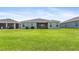 Large backyard with a grassy area at 16120 67Th E Ct, Parrish, FL 34219