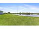 Grass lawn and pond view at 16120 67Th E Ct, Parrish, FL 34219