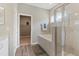 Clean bathroom with a shower and soaking tub at 16120 67Th E Ct, Parrish, FL 34219