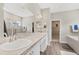 Elegant bathroom with double sinks and a large bathtub at 16120 67Th E Ct, Parrish, FL 34219
