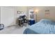 Bright bedroom with a desk, chair, and a bed at 16120 67Th E Ct, Parrish, FL 34219