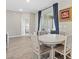 Dining area with round table and four chairs, near sliding doors at 16120 67Th E Ct, Parrish, FL 34219