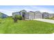 Two-car garage, well-manicured lawn, and attractive landscaping at 16120 67Th E Ct, Parrish, FL 34219