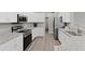 Modern kitchen with stainless steel appliances and granite counters at 16120 67Th E Ct, Parrish, FL 34219