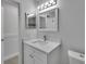 Modern bathroom featuring a white vanity and quartz countertop at 1613 Alhambra Crest Dr, Ruskin, FL 33570