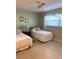 Cozy bedroom with twin beds, ceiling fan, and tiled floors at 1652 S Lake Ave # 2, Clearwater, FL 33756