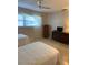 Well-lit bedroom with twin beds and dresser at 1652 S Lake Ave # 2, Clearwater, FL 33756