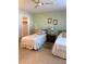 Spacious bedroom with twin beds and ample closet space at 1652 S Lake Ave # 2, Clearwater, FL 33756