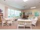 Bright community room with seating, tables, and piano at 1652 S Lake Ave # 2, Clearwater, FL 33756