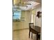 Bright kitchen featuring white cabinets, granite counters, and a breakfast nook at 1652 S Lake Ave # 2, Clearwater, FL 33756
