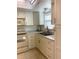 Clean and bright kitchen with white cabinets and double sink at 1652 S Lake Ave # 2, Clearwater, FL 33756