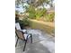 Small patio area with two chairs and backyard view at 1652 S Lake Ave # 2, Clearwater, FL 33756