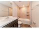 Bathroom with single vanity, bathtub, and toilet at 19474 Strathcona Ave, Port Charlotte, FL 33954