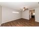 Bedroom with ceiling fan and access to bathroom at 19474 Strathcona Ave, Port Charlotte, FL 33954
