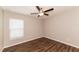 Bedroom with wood-look floors and ceiling fan at 19474 Strathcona Ave, Port Charlotte, FL 33954