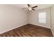 Bedroom with wood-look floors and ceiling fan at 19474 Strathcona Ave, Port Charlotte, FL 33954