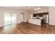 Modern kitchen with stainless steel appliances and access to patio at 19474 Strathcona Ave, Port Charlotte, FL 33954