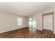 Living room with sliding glass doors and wood flooring at 19474 Strathcona Ave, Port Charlotte, FL 33954