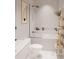 Modern bathroom with white hexagonal tile, bathtub, and walk-in shower at 2100 4Th S St, St Petersburg, FL 33705