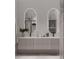 Spa-like bathroom with double vanity, frameless shower, and marble floors at 2100 4Th S St, St Petersburg, FL 33705