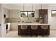 Modern kitchen with island, stainless steel appliances, and marble backsplash at 2100 4Th S St, St Petersburg, FL 33705