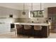 Modern kitchen with island, stainless steel appliances, and marble backsplash at 2100 4Th S St, St Petersburg, FL 33705