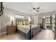 Main bedroom with a ceiling fan, and large window at 220 Dale Pl, Oldsmar, FL 34677