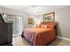 Comfortable bedroom with a queen bed and access to a private balcony at 220 Dale Pl, Oldsmar, FL 34677