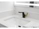 Close-up view of modern bathroom sink and black and gold faucet at 2307 Mary Sue St, Largo, FL 33774