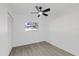 Simple bedroom with ceiling fan and vinyl flooring at 2307 Mary Sue St, Largo, FL 33774