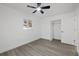 Bright bedroom with wood-look floors and a large closet at 2307 Mary Sue St, Largo, FL 33774
