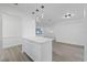 White kitchen island with quartz countertop and pendant lighting at 2307 Mary Sue St, Largo, FL 33774