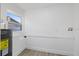 Bright laundry room with vinyl flooring and overhead window at 2307 Mary Sue St, Largo, FL 33774