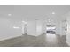 Open living area with wood-look floors and access to backyard at 2307 Mary Sue St, Largo, FL 33774