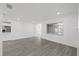 Open living area with wood-look floors and kitchen view at 2307 Mary Sue St, Largo, FL 33774