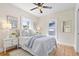 Light and airy bedroom with a queen-size bed and hardwood floors at 235 11Th Ne Ave, St Petersburg, FL 33701