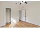 Bedroom with hardwood floors and access to a hallway at 235 11Th Ne Ave, St Petersburg, FL 33701