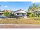 Updated bungalow exterior with a spacious lawn at 235 11Th Ne Ave, St Petersburg, FL 33701