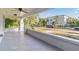 Spacious front porch with view of the tree-lined street at 235 11Th Ne Ave, St Petersburg, FL 33701