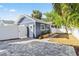 Detached garage with paved parking area and landscaping at 235 11Th Ne Ave, St Petersburg, FL 33701