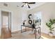 Bright home office features hardwood floors, built-in shelving and a large window at 235 11Th Ne Ave, St Petersburg, FL 33701
