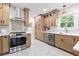 Stylish kitchen with light wood cabinets and a gas range at 235 11Th Ne Ave, St Petersburg, FL 33701