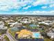 Aerial view of community features including tennis courts, pool, and clubhouse at 2430 Florentine Way # 38, Clearwater, FL 33763
