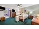 Spacious bedroom with wood furniture and green carpeting at 2430 Florentine Way # 38, Clearwater, FL 33763