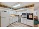 Bright kitchen featuring stainless steel appliances and wood-look flooring at 2430 Florentine Way # 38, Clearwater, FL 33763