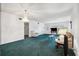 Spacious living room with green carpet and ample natural light at 2430 Florentine Way # 38, Clearwater, FL 33763